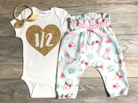 Image of 1/2 In Heart Outfit 6 Month Old Baby Girl - Gold Glitter Bodysuit + Boho Bull Skull Pants + Matching Bow - Celebrate Half Birthday