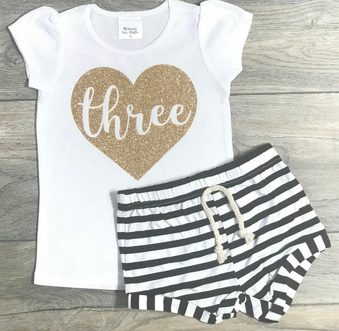 Image of Three In Heart 3rd Birthday Outfit For Girls - Third Birthday White Short Puff Sleeve Gold Glitter Shirt + Black Striped Shorts 3 Year Old